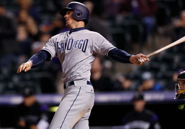 San Diego Padres' Wil Myers follows the flight of his triple off Colorado Rockies relief pitcher Carlos Estevez in the eighth inning of a baseball game Monday, April 10, 2017, in Denver. The Padres won 5-3. (AP Photo/David Zalubowski) ORG XMIT: CODZ115