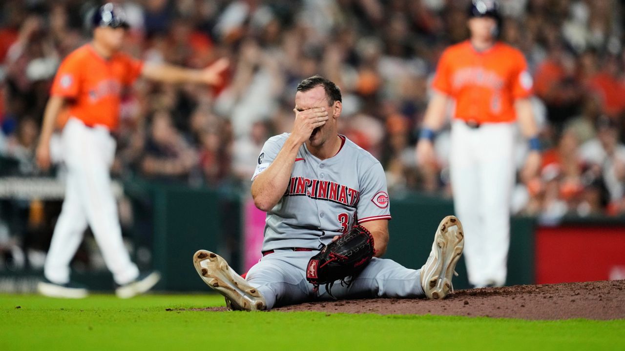 Cincinnati Reds relief pitcher Brent Suter (31) reacts as Houston Astros' Mauricio Dubón grounds out during the eighth inning of a baseball game in Houston, Friday, May 9, 2025.