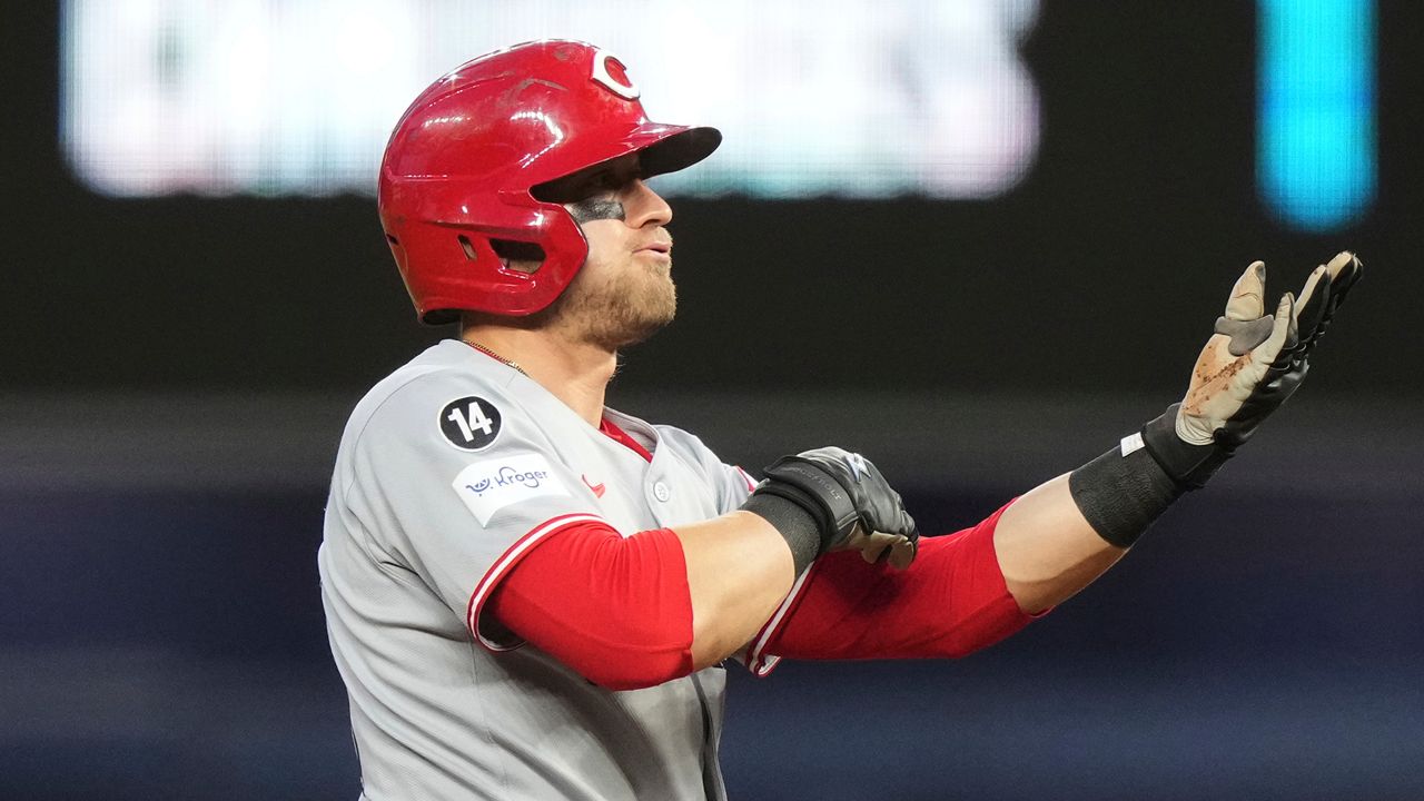 Cincinnati Reds' TJ Friedl reacts after hitting a double during the fifth inning of a baseball game against the Miami Marlins, Tuesday, April 22, 2025, in Miami. (AP Photo/Lynne Sladky)