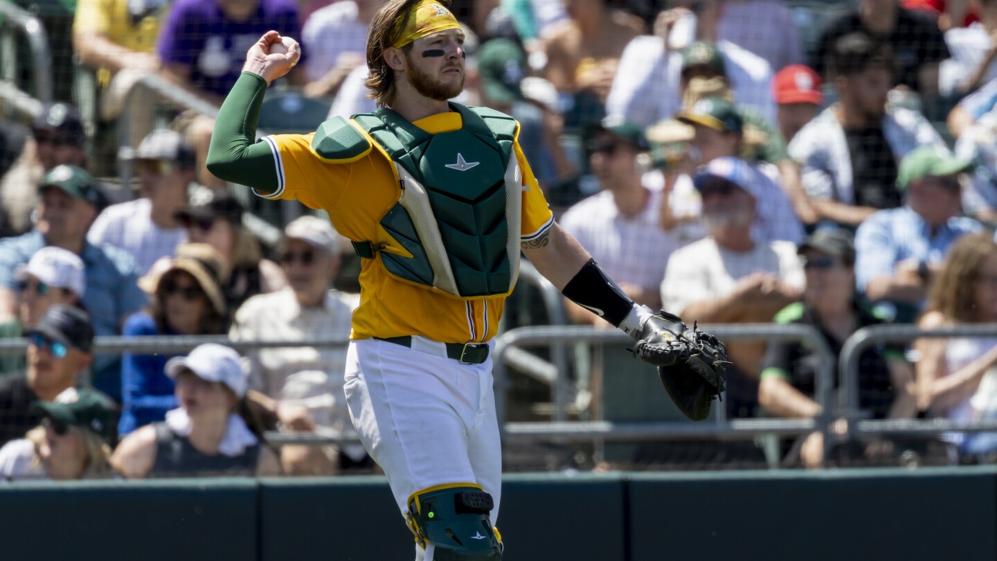 MacIver hits go-ahead single, throws out runner to end game as A's stop skid and Phils' win streak