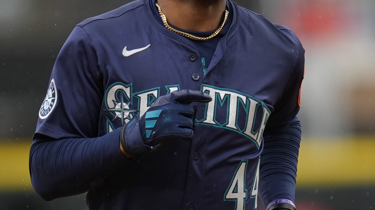 Julio Rodríguez scratched from Mariners' lineup with back tightness, day to day