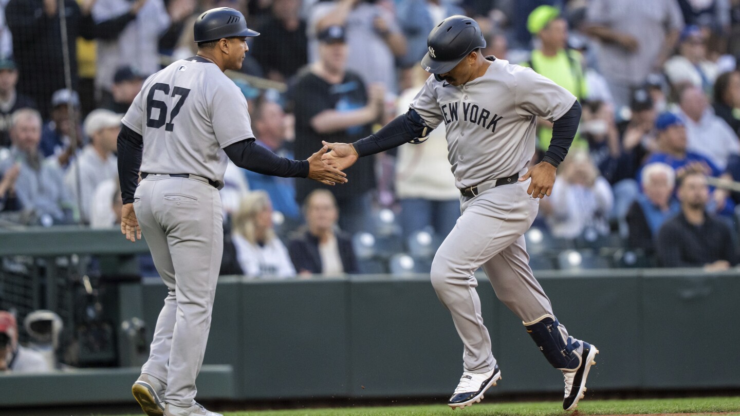 Grisham hits 2 homers to lead Yankees past Mariners 11-5, New York's Cabrera leaves in ambulance