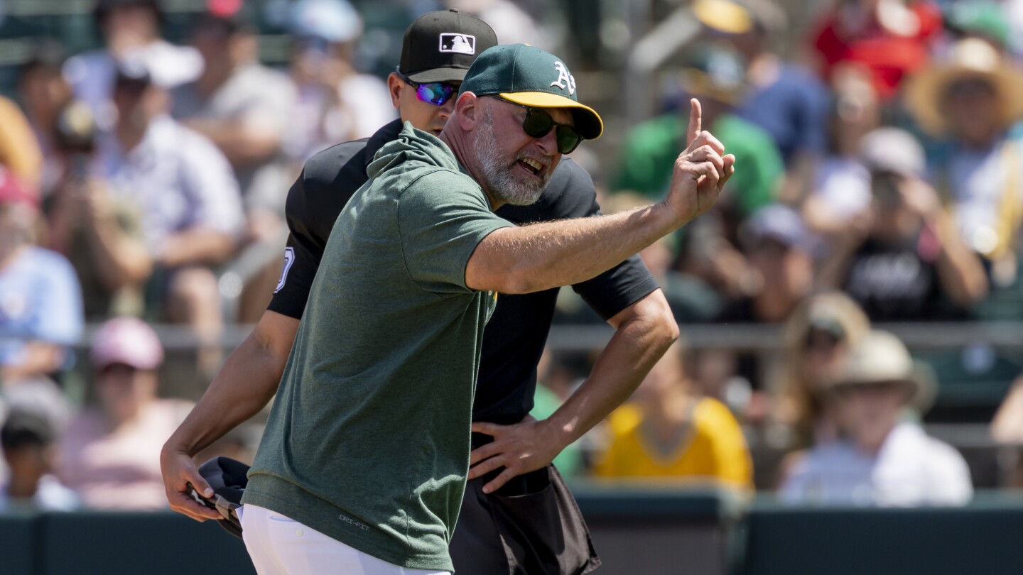 A's manager Mark Kotsay and third baseman Miguel Andujar ejected after arguing called strike