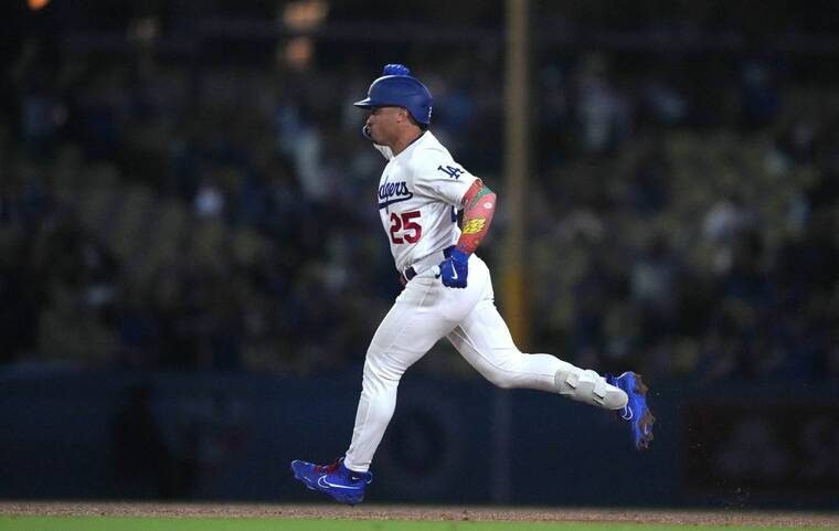 KIRBY LEE-USA TODAY SPORTS
Los Angeles Dodgers second baseman Kolten Wong runs the bases, in September 2023, after hitting a home run in the ninth inning against the San Diego Padres at Dodger Stadium.