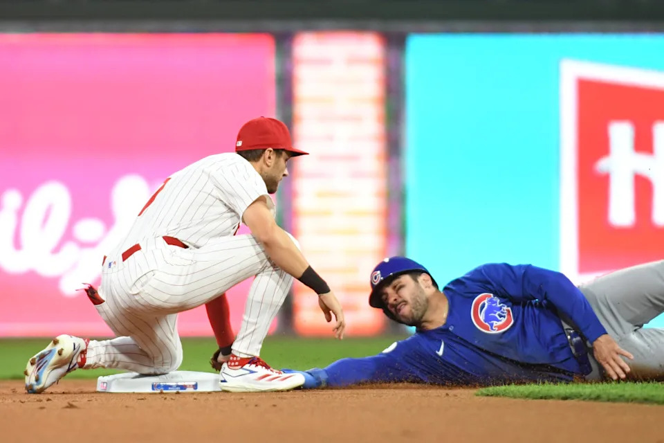 Philadelphia Phillies shortstop Trea Turner (7) tags out Chicago Cubs outfielder Mike Tauchman (40) while trying to steal second base during the first inning at Citizens Bank Park.Eric Hartline-Imagn Images