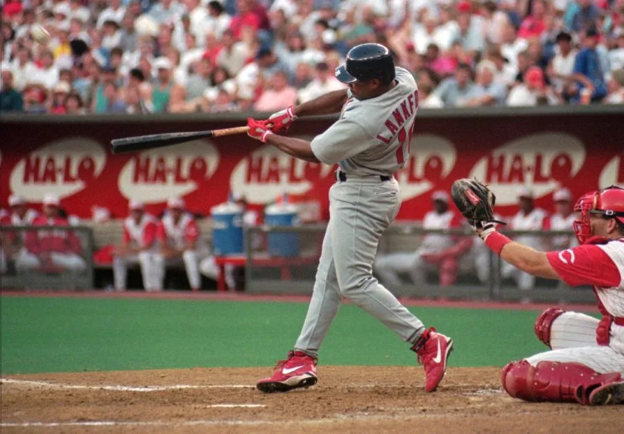 St. Louis Cardinals’ Ray Lankford hits his second home run of the game off Cincinnati Reds pitcher Brett Tomko Tuesday, July 15, 1997, during the third inning in Cincinnati. Both home runs were in the upper deck red seats as Lankford became the first player in the history of the stadium to hit two such home runs in the same game. Catching is Joe Oliver. (AP Photo/Al Behrman)
