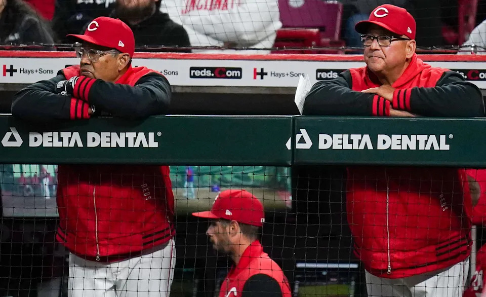 Bench coach Freddie Benavides (left) will manage the Reds Friday in Milwaukee with Terry Francona (right) sidelined with a flu-like bug.