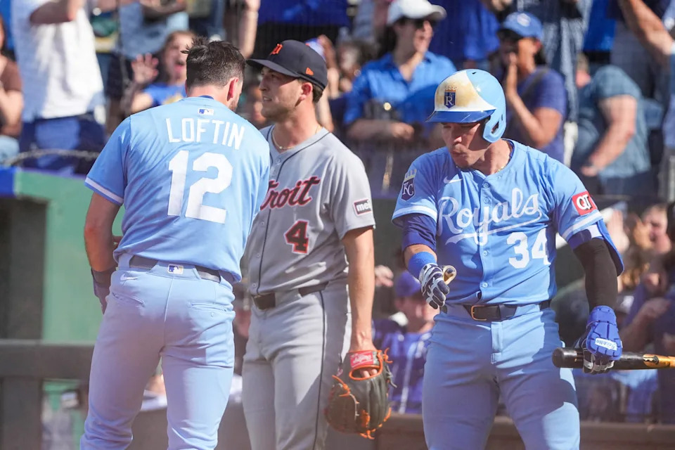Kansas City Royals left fielder Nick Loftin (12) celebrates with catcher Freddy Fermin (34) after scoring against the Detroit Tigers in the eighth inning at Kauffman Stadium in Kansas City, Missouri, on Saturday, May 31, 2025.