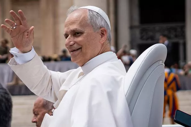 Pope Leo XIV waves at St. Peter's Square