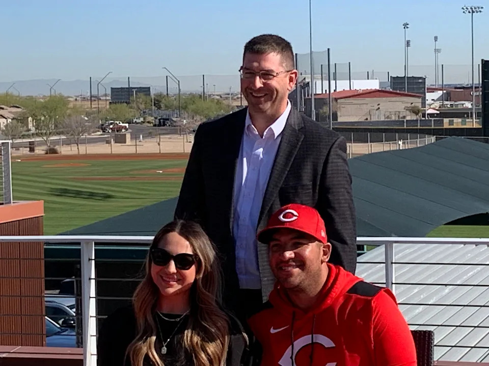 Cincinnati Reds catcher Jose Trevino, wife Markie and Reds president Nick Krall during Friday's press conference. Trevino is now signed through 2027 with a club option for 2028.
