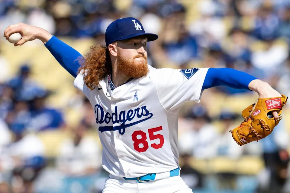 Dodgers pitcher Dustin May delivers against the Giants at Dodger Stadium on Sunday.