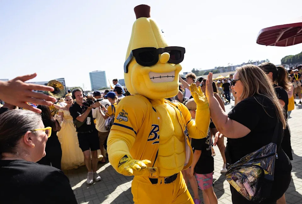 Savannah Bananas mascot Split marches through the crowd before the team's game against the Firefighters at Angel Stadium