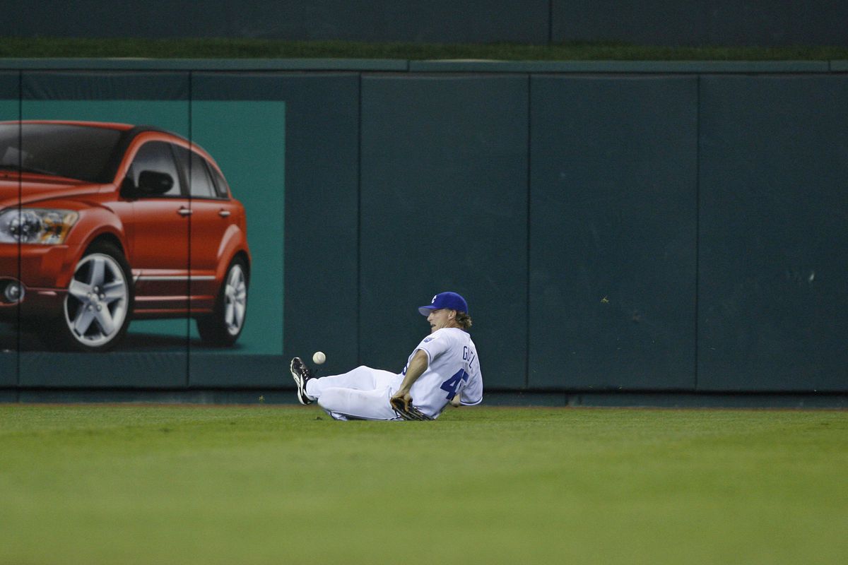 Aaron Guiel of the Royals attempts to make a diving catch during action between the Detroit Tigers and Kansas City Royals at Kauffman Stadium in Kansas City, Missouri on May 23, 2006. Detroit won 8-5.