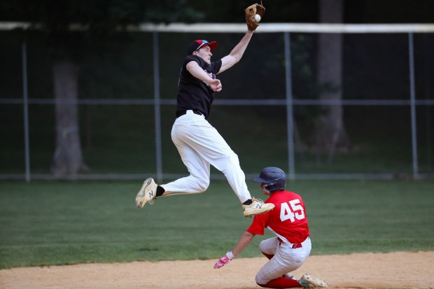 Barnstormers second baseman  Clay Cormiglia leaps for the ball as the Jays' Joe Mozzone slides  into second. Tom Silknitter for Daily Local News