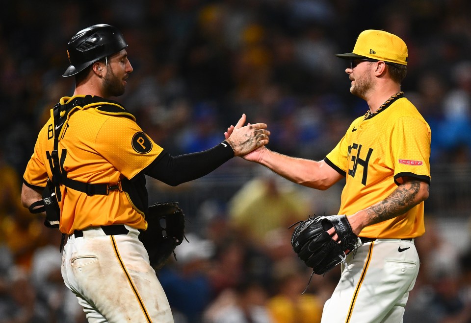 Pittsburgh Pirates players Joey Bart and Chase Shugart celebrating a win.
