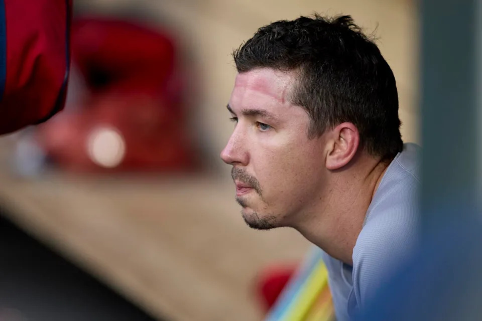 Boston Red Sox starting pitcher Walker Buehler sits in the dugout.