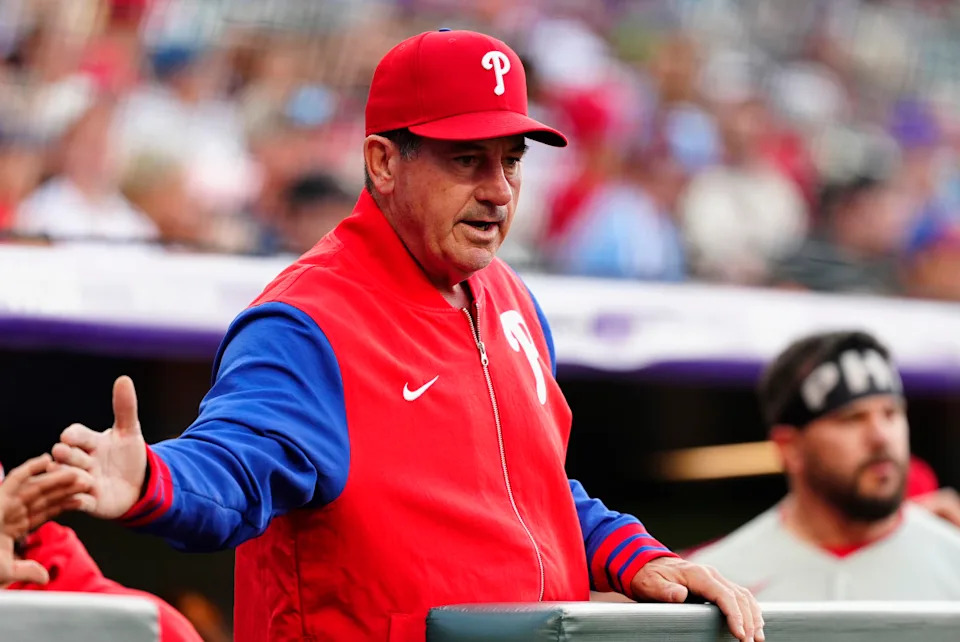 Philadelphia Phillies manager Rob Thomson (59) celebrates a run scored in the first inning against the Colorado Rockies at Coors Field.Ron Chenoy-Imagn Images
