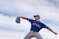Texas Rangers pitcher Cody Bradford throws in the bullpen during a spring training workout...
