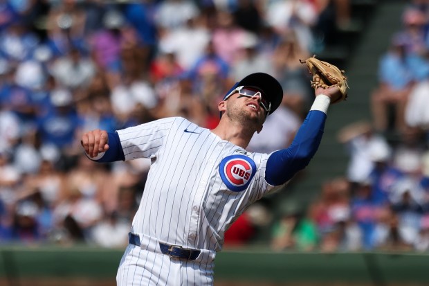Chicago Cubs second baseman Nico Hoerner (2) catches a pop-up during the sixth inning against the Cincinnati Reds at Wrigley Field on Sunday, June 1, 2025. (Eileen T. Meslar/Chicago Tribune)