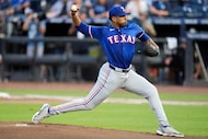 Texas Rangers' Kumar Rocker pitches to the Tampa Bay Rays during the first inning of a...