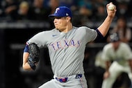 Texas Rangers pitcher Robert Garcia delivers to the Tampa Bay Rays during the ninth inning...
