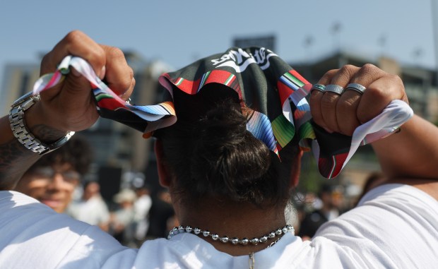Ruben Aerzet puts on a bandana before a White Sox-Royals...
