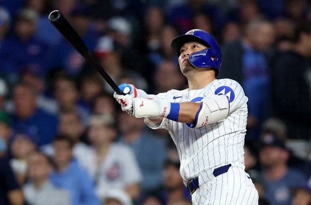Cubs designated hitter Seiya Suzuki hits a solo home run in the sixth inning against the Pirates on June 12, 2025, at Wrigley Field. (Chris Sweda/Chicago Tribune)