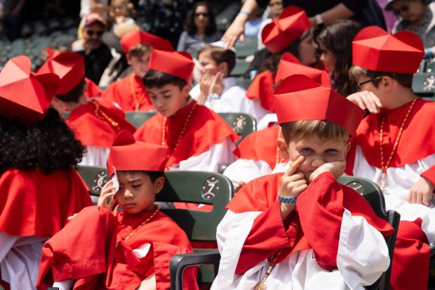 Students of Our Lady of Mt. Carmel Academy, who held...