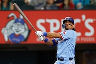 Texas Rangers left fielder Alejandro Osuna (19) watches as he fouls off a pitch during the...