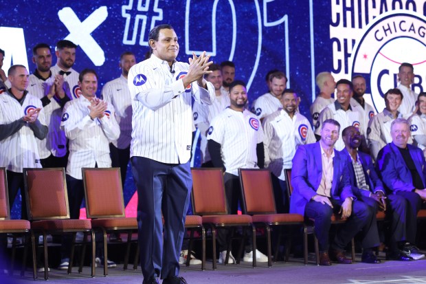 Former Cubs player Sammy Sosa acknowledges fans as he is...