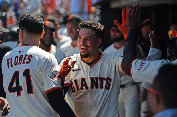 San Francisco Giants' Willy Adames (2) celebrates in the dugout after hitting a solo home run in the eighth inning of their MLB game at Oracle Park in San Francisco, Calif., on Sunday, June 22, 2025. The San Francisco Giants defeated the Boston Red Sox 9-5. (Jose Carlos Fajardo/Bay Area News Group)