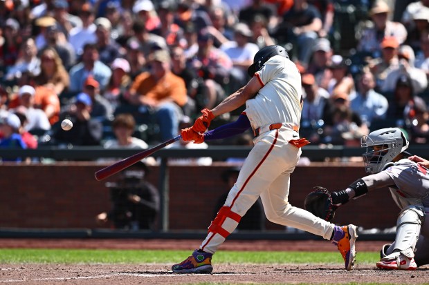 San Francisco Giants' Willy Adames (2) connects for a solo...