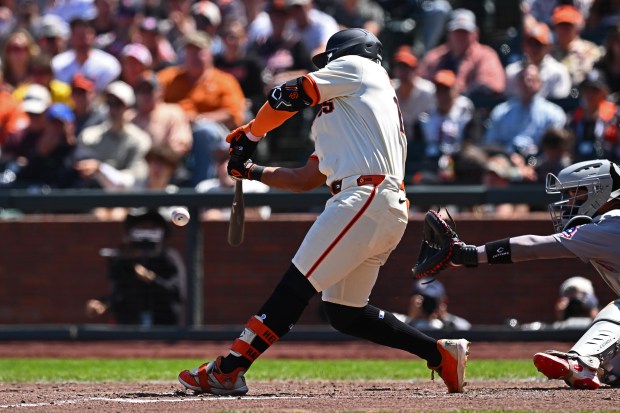 San Francisco Giants' Heliot Ramos (17) connects for a two-run...