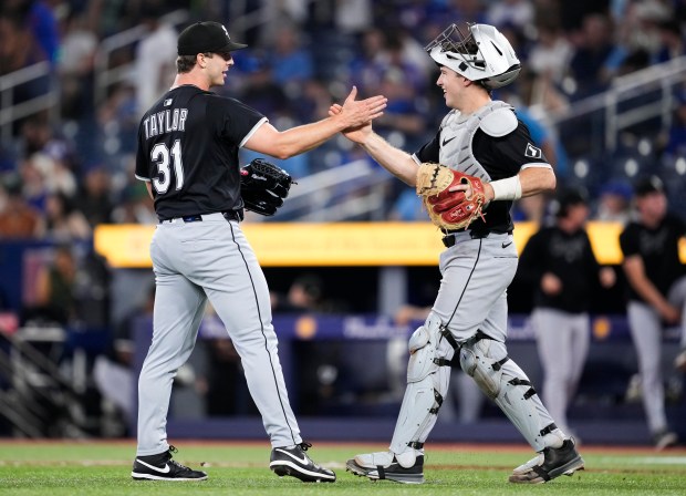 Grant Taylor and catcher Kyle Teel of the White Sox celebrate a victory over the Blue Jays on June 22, 2025, in Toronto. (Mark Blinch/Getty Images)