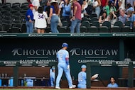 Texas Rangers second baseman Marcus Semien heads to the dugout after making the final out of...