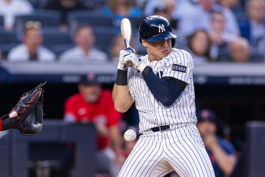 Anthony Volpe of the New York Yankees is hit by a pitch 
