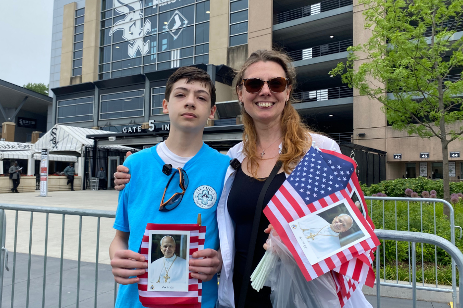 Jennifer Arreola and her son Donavon brought American flags with an image of Pope Leo XIV to a celebration of the first U.S.-born pope at Rate Field in Chicago, June 14, 2025. “He’s one of us,” said Arreola. Photo by Jonathan Liedl/National Catholic Register