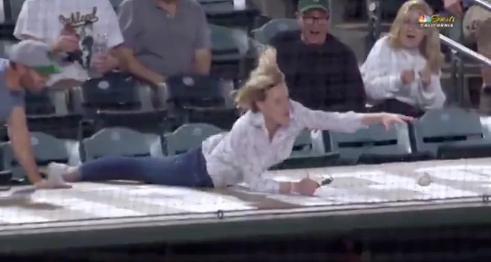 One fan at Wednesday’s A’s-Twins game went all-out for a foul ball.