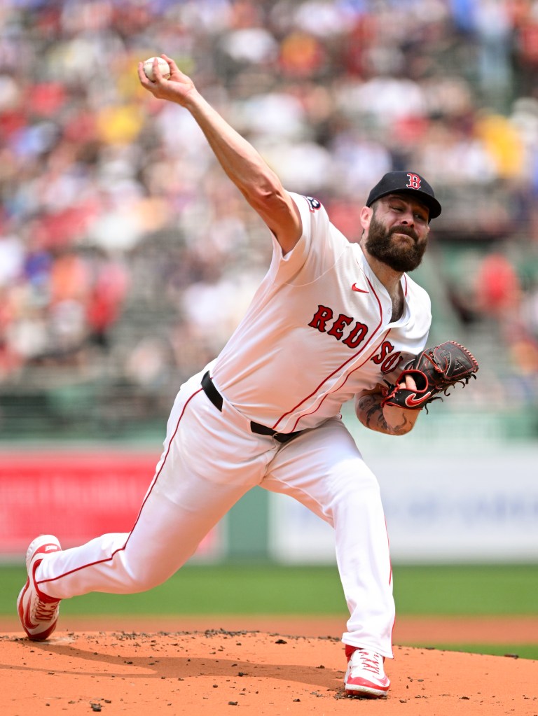 Boston Red Sox pitcher throwing a baseball.
