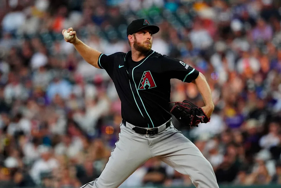 Arizona Diamondbacks starting pitcher Merrill Kelly (29) delivers a pitchRon Chenoy-Imagn Images