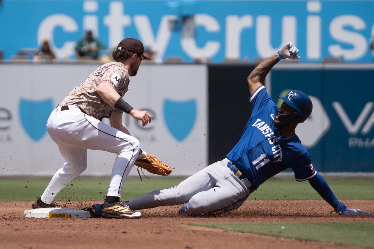 San Diego Padres infielder Jake Cronenworth (9) tags Kansas City Royals infielder Maikel Garcia (11) during an MLB game on June 22, 2025 at Petco Park in San Diego, CA.
