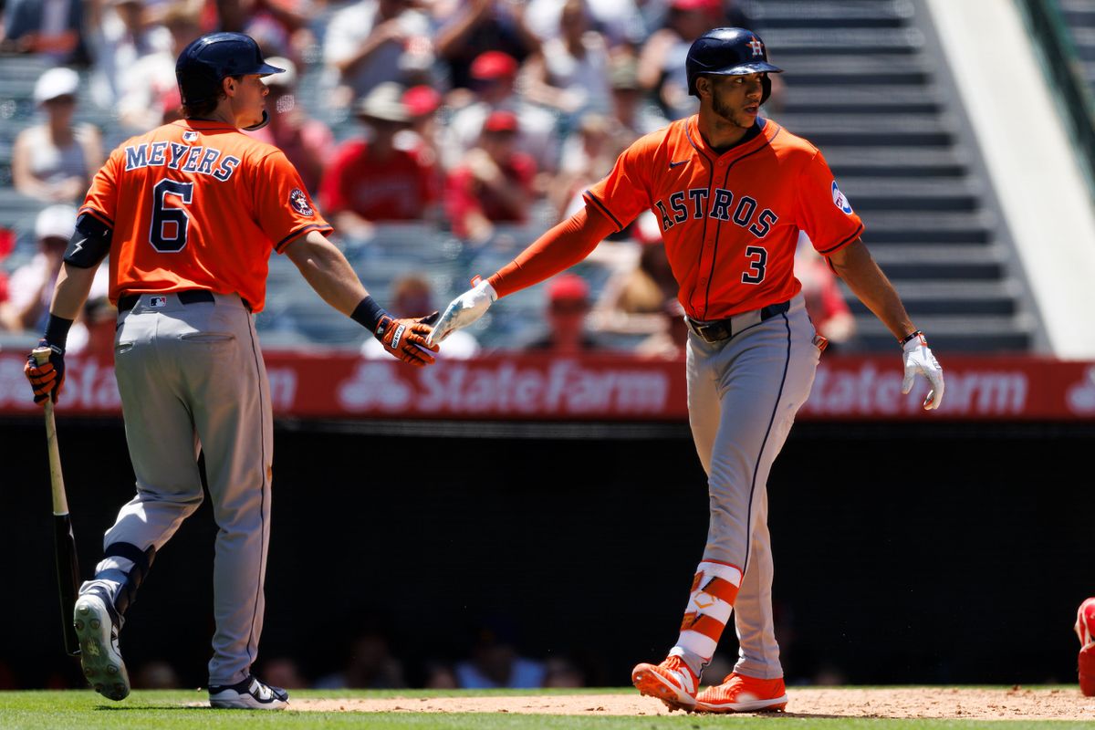 Jeremy Peña #3 of the Houston Astros celebrates with Jake Meyers #6 of the Houston Astros during the game against the Los Angeles Angels at Angel Stadium of Anaheim on June 22, 2025 in Anaheim, California.