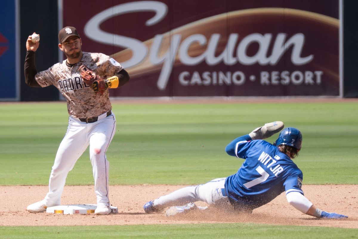 San Diego Padres infielder José Iglesias (7) turns a double play during an MLB game against the Kansas City Royals on June 22, 2025 at Petco Park in San Diego, CA.