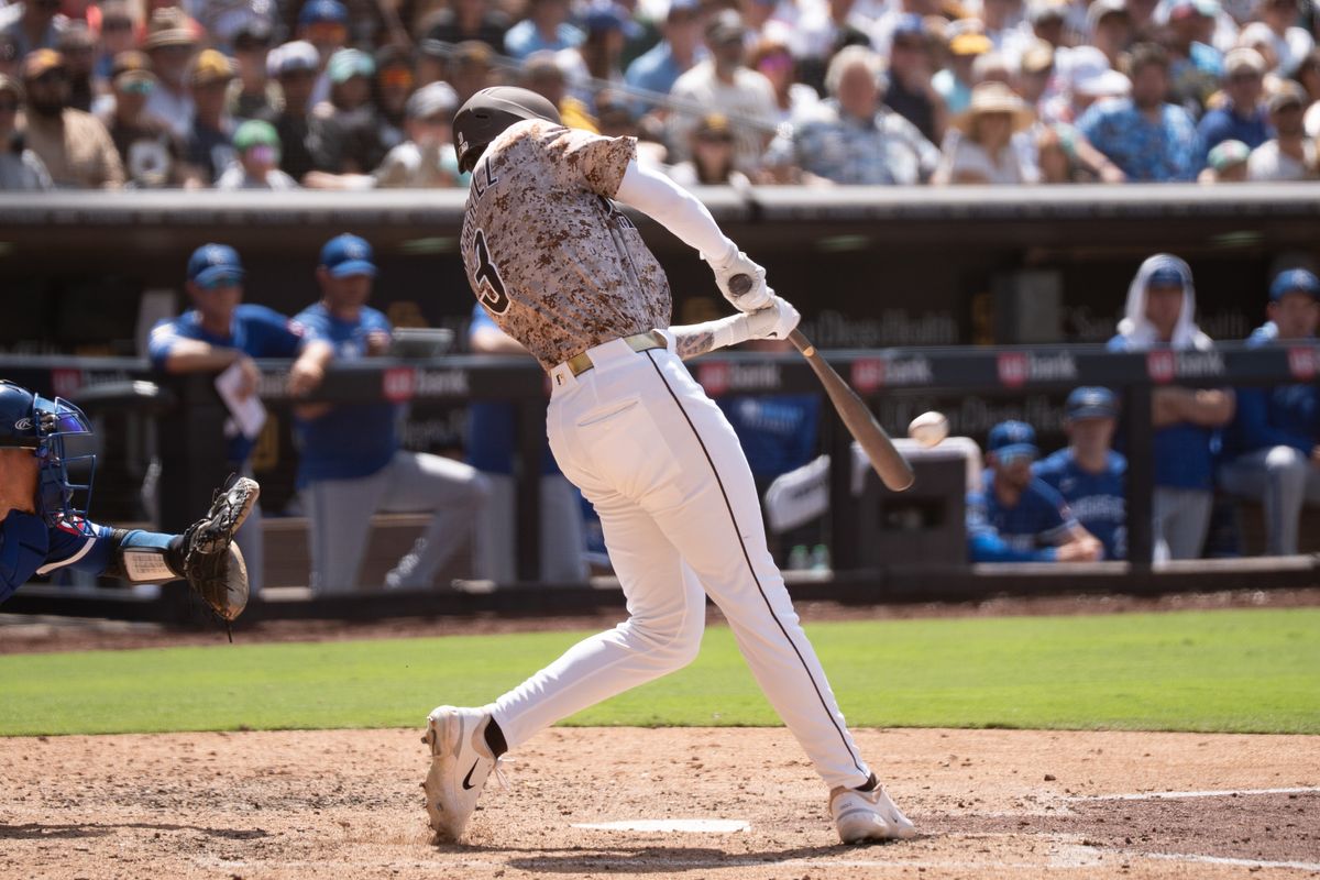 San Diego Padres outfielder Jackson Merril (3) hits the ball during an MLB game against the Kansas City Royals on June 22, 2025 at Petco Park in San Diego, CA.