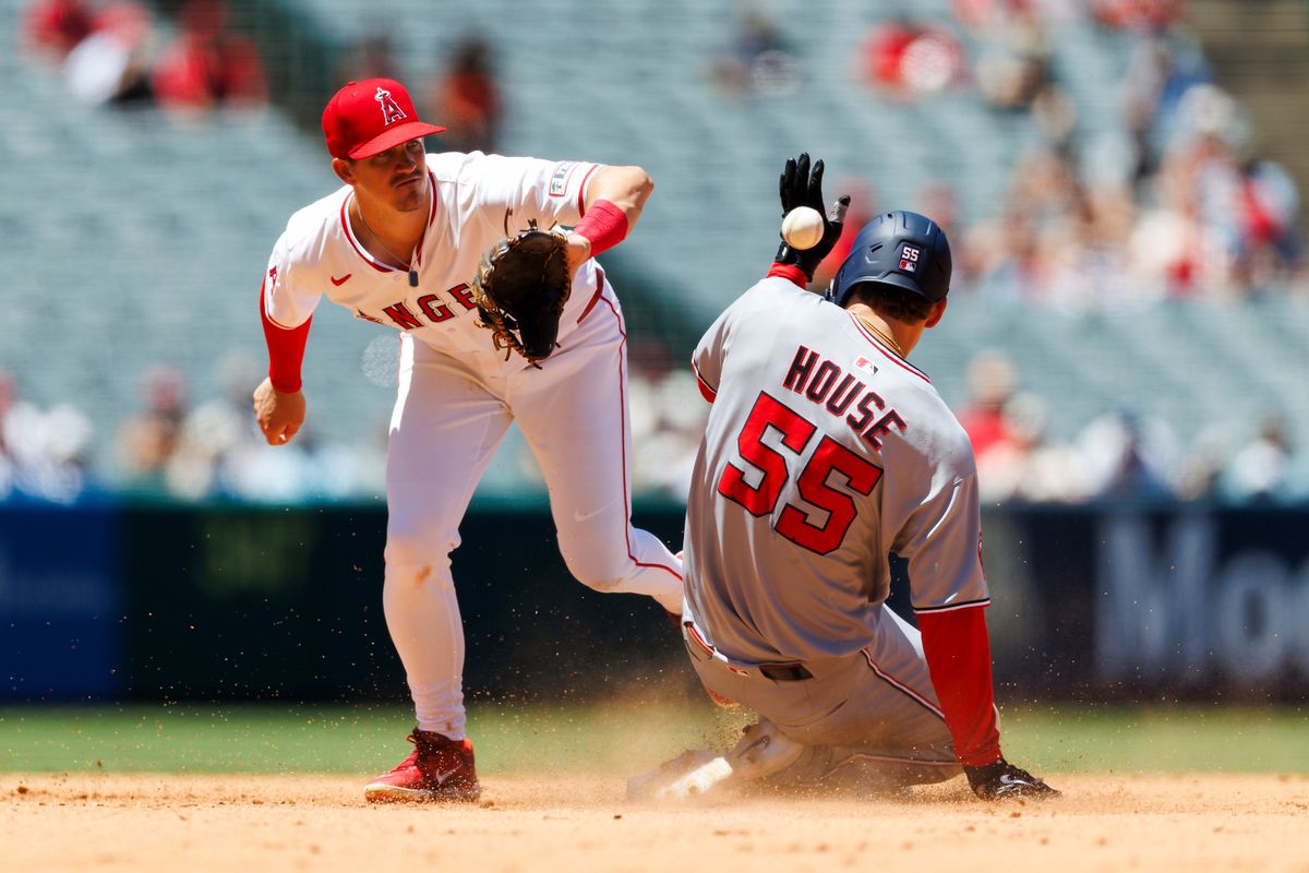 Brady House #55 of the Washington Nationals slides into second base during the game against the Los Angeles Angels at Angel Stadium of Anaheim on June 29, 2025 in Anaheim, California. 