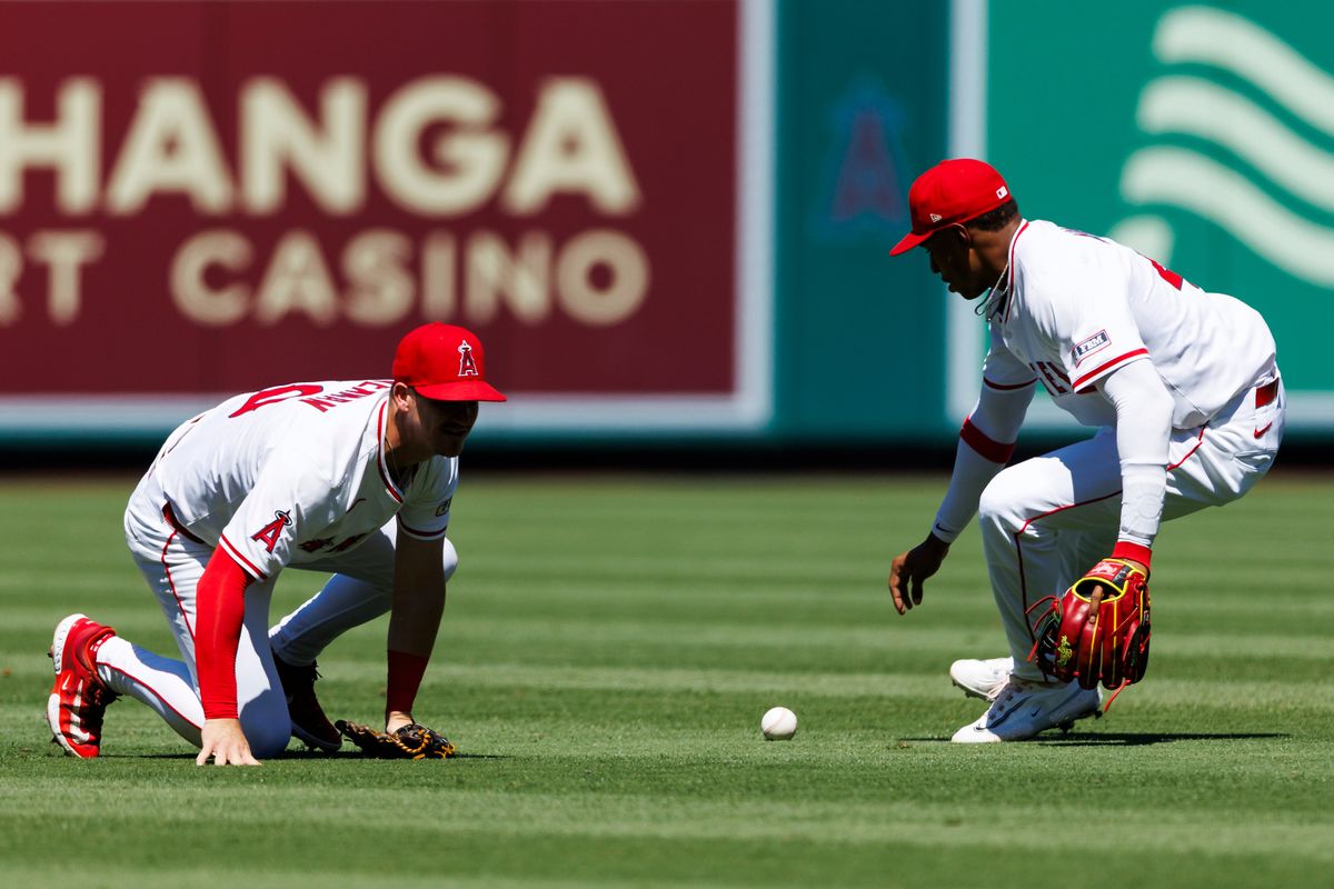 Kevin Newman #10 of the Los Angeles Angels drops the ball during the game against the Washington Nationals at Angel Stadium of Anaheim on June 29, 2025 in Anaheim, California.