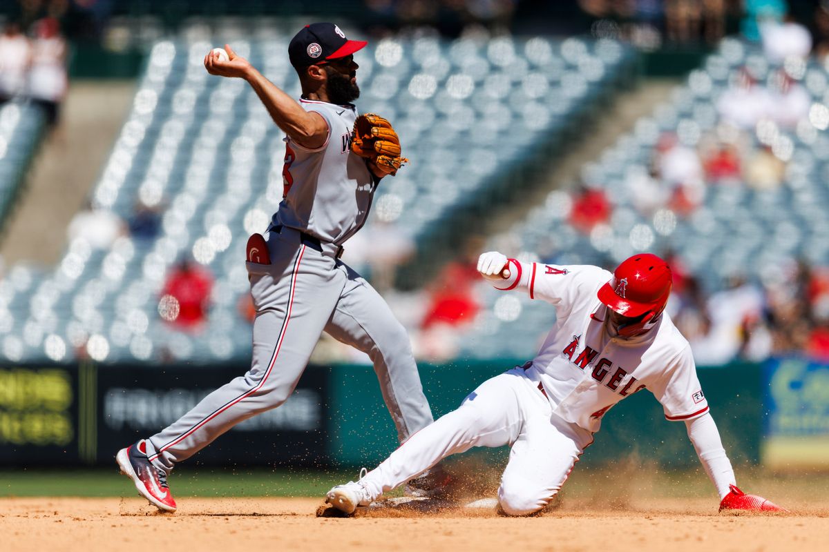 Christian Moore #4 of the Los Angeles Angels slides into second base during the game against the Washington Nationals at Angel Stadium of Anaheim on June 29, 2025 in Anaheim, California. 