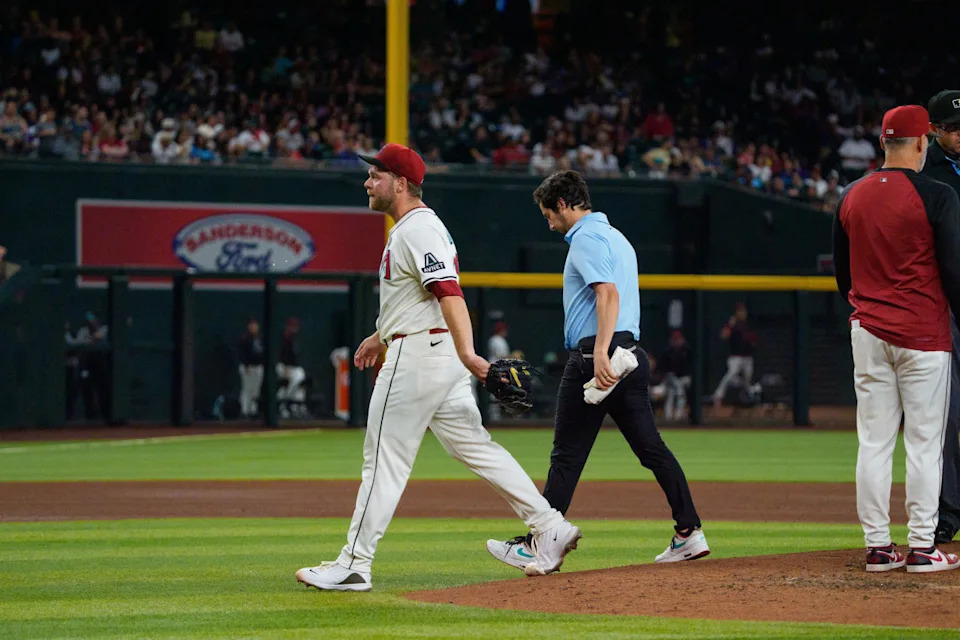 Arizona Diamondbacks starting pitcher Corbin Burnes (39) reacts after an injury in the fifth inningAllan Henry-Imagn Images