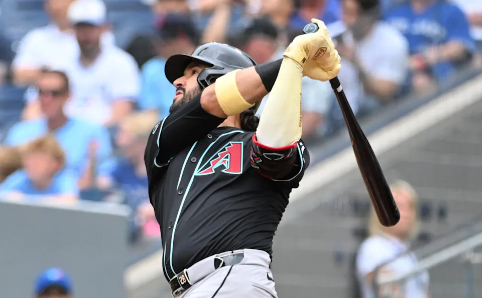 Arizona Diamondbacks third baseman Eugenio Suarez (28) hits a two run home run against the Toronto Blue Jays in the second inning at Rogers Centre.Dan Hamilton-Imagn Images