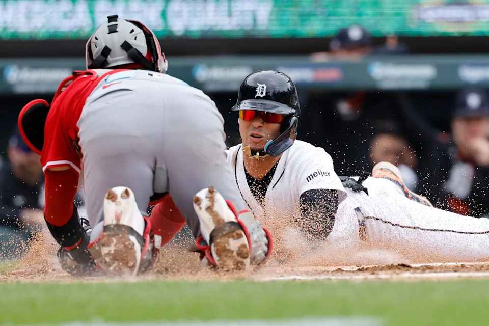 Tigers shortstop Javier Báez is tagged out a home plate by Reds catcher Jose Trevino in the third inning Saturday June 14. Baez was thrown out by Elly De La Cruz, who took the cutoff thrown from right fielder Jake Fraley, who fielded the ball on a bounce off the wall.